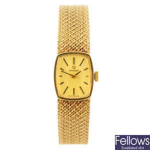 OMEGA - a lady's bracelet watch together with a wrist watch.