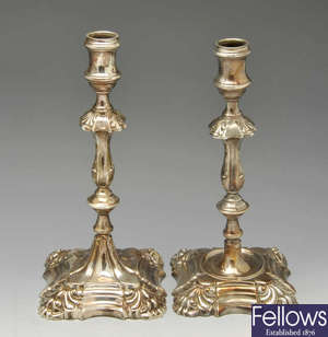 Two modern similar silver candlesticks in eighteenth century style.