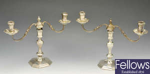 A pair of modern silver candelabra.