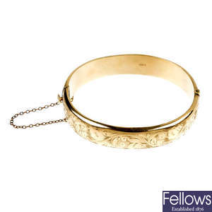A mid 20th century 9ct gold hinged bangle.