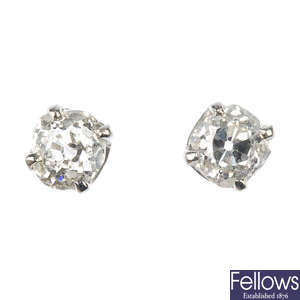 A pair of old-cut diamond single-stone ear studs.