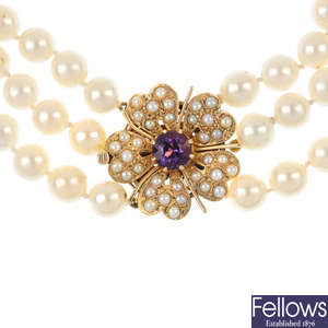 A cultured pearl three-row necklace with amethyst and split pearl clasp.