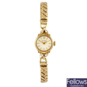 ROLEX - a lady's yellow metal bracelet watch.