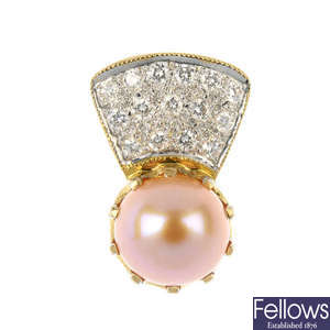 A cultured pearl and diamond pendant.
