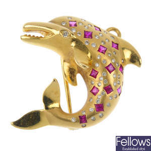 A ruby and diamond dolphin brooch.