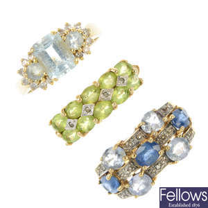 A selection of three gold gem-set dress rings.