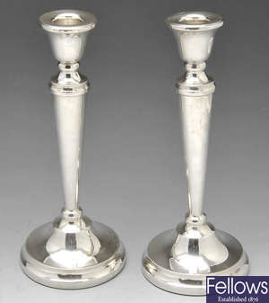 A pair of modern silver candlesticks.