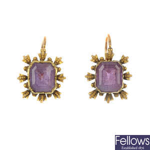 A pair of amethyst single-stone earrings. 