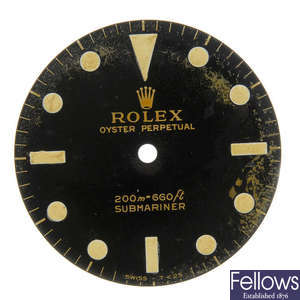 ROLEX - a gloss black Singer dial with gilt writing for a Submariner. 
