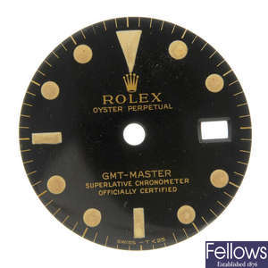 ROLEX - a gloss black Singer dial with gilt writing for a GMT-Master. 