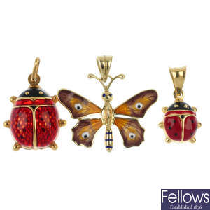 A selection of three enamel insect pendants.