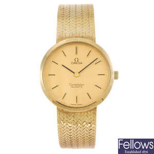 OMEGA - a gentleman's 9ct yellow gold Constellation bracelet watch.
