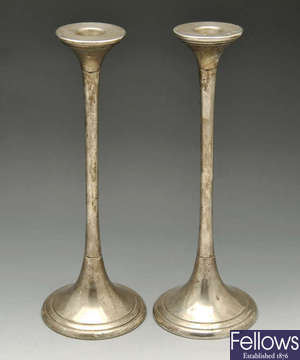 A pair of modern silver trumpet shape candlesticks.
