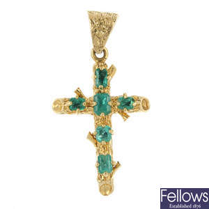 An emerald cross pendant.