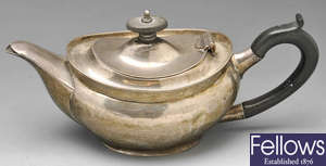 A George V silver bachelor teapot.
