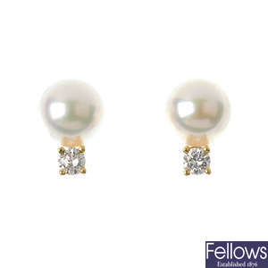 MIKIMOTO _ a pair of 18ct gold cultured pearl and diamond ear studs.