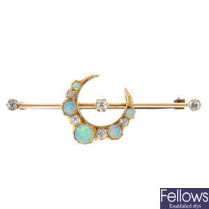 An early 20th century 15ct gold diamond and opal crescent brooch.