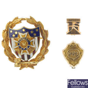 An enamel military brooch and two further brooches. 