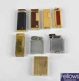 A small group of assorted lighters to include a Cartier gold plated example, etc.
