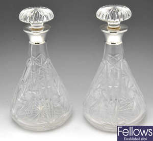 A pair of modern silver mounted cut glass decanters