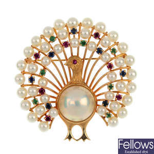 A cultured pearl and gem-set peacock brooch.