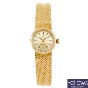 OMEGA - a yellow metal lady's Geneve bracelet watch.