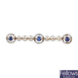 An early 20th century gold, sapphire and diamond bar brooch.