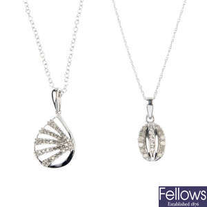 A selection of four diamond and gem-set pendants.