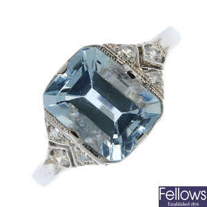 An aquamarine and diamond ring.