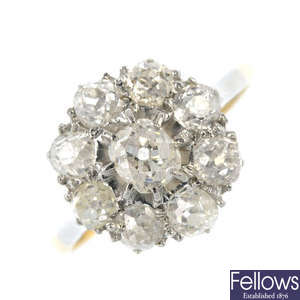 A mid 20th century 18ct gold and platinum diamond cluster ring.