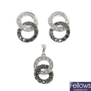A selection of five sets of diamond and black-gem jewellery.