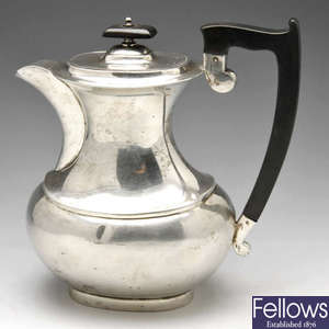 A 1940's silver hot water pot.