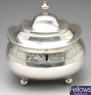 A George III silver tea caddy.