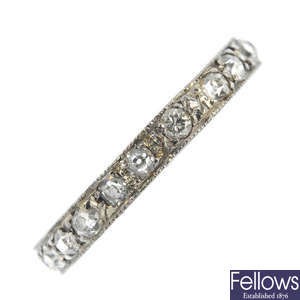 An early 20th century platinum and diamond full-circle eternity ring.