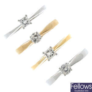 A selection of four 18ct gold diamond single-stone rings.