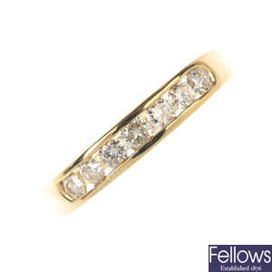 A 9ct gold diamond half-circle eternity ring.