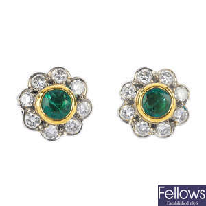 A pair of 18ct gold emerald and diamond floral cluster ear studs.