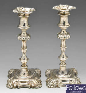  A pair of William IV silver candlesticks. 