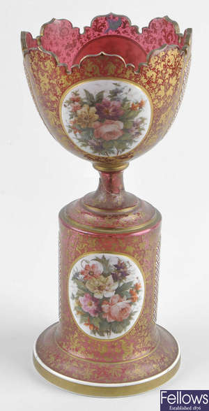 A large late 19th century Bohemian overlay cranberry glass pedestal centerpiece