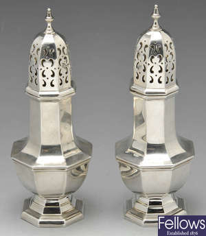 A George V pair of silver casters.
