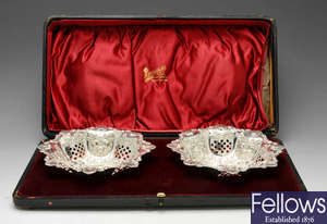 A cased pair of late Victorian silver bonbon dishes.