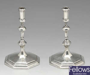 A late Victorian pair of silver tapersticks.