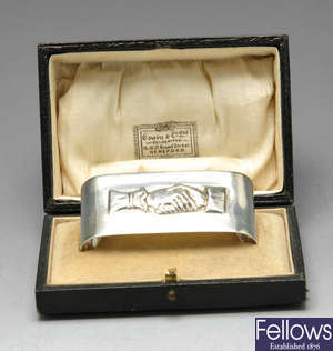 A George V novelty silver napkin ring.