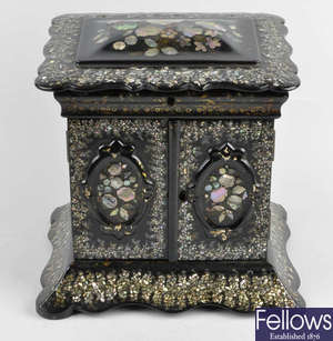 A 19th century papier mache and mother of pearl inlaid table cabinet