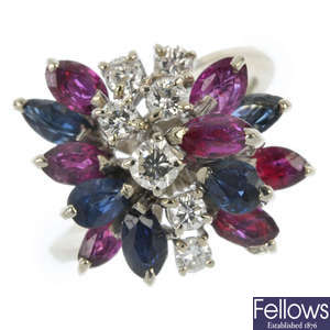 A mid 20th century 18ct gold, diamond, ruby and sapphire floral cocktail ring.