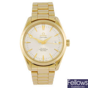 OMEGA - a gentleman's 18ct gold Seamaster Aqua Terra Co-Axial bracelet watch.