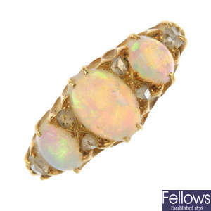 An early 20th century 18ct gold opal and diamond three-stone ring.