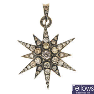 H STERN - a diamond star pendant.