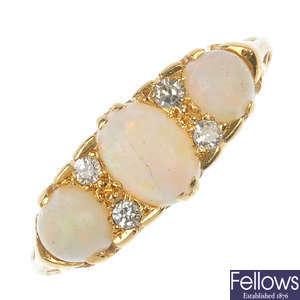 A gold opal and diamond ring.