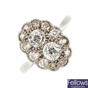 A mid-20th century 18ct gold and platinum diamond cluster ring. 